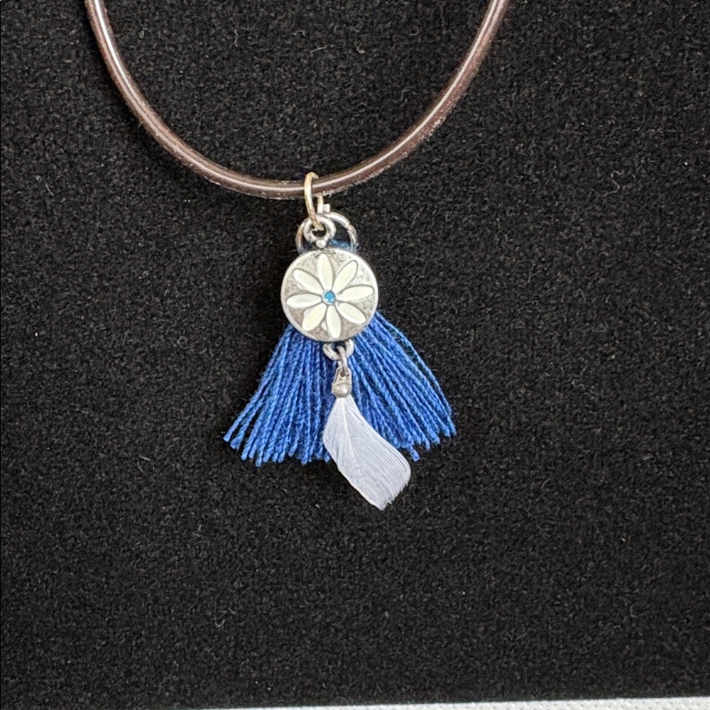 NWOT Boho style necklace. 18 inches. Brown nylon cord.